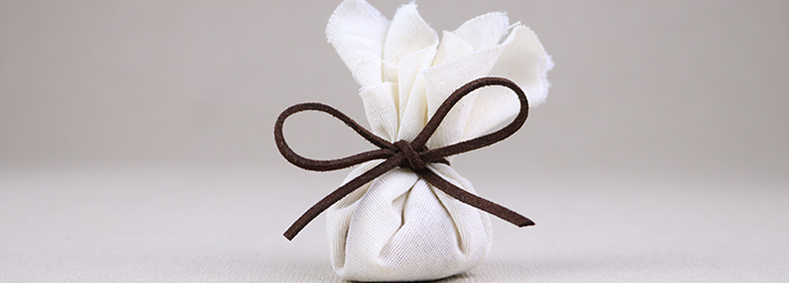white parcel tied up with a bow